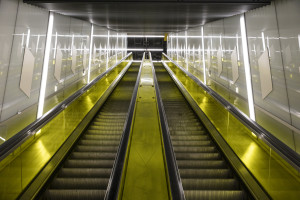 Canary Wharf station: The station ticket hall is accessed via eight long-rise escalators from the promenade level entrances at either end of the building.